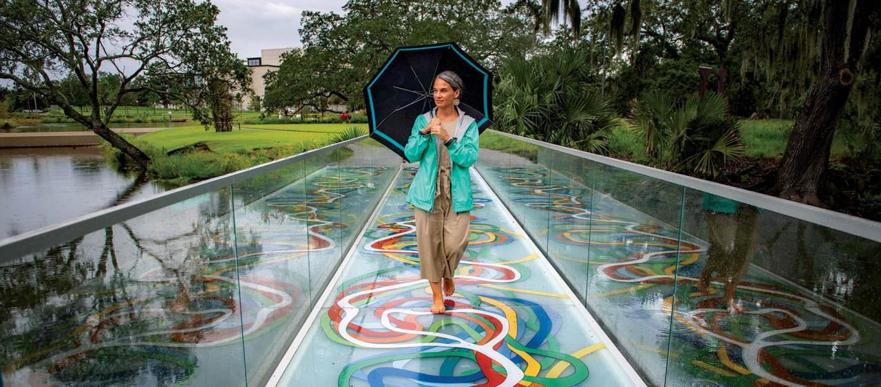 Rebecca Snedeker walking across the Elyn Zimmerman Glass Bridge, City Park, New Orleans
