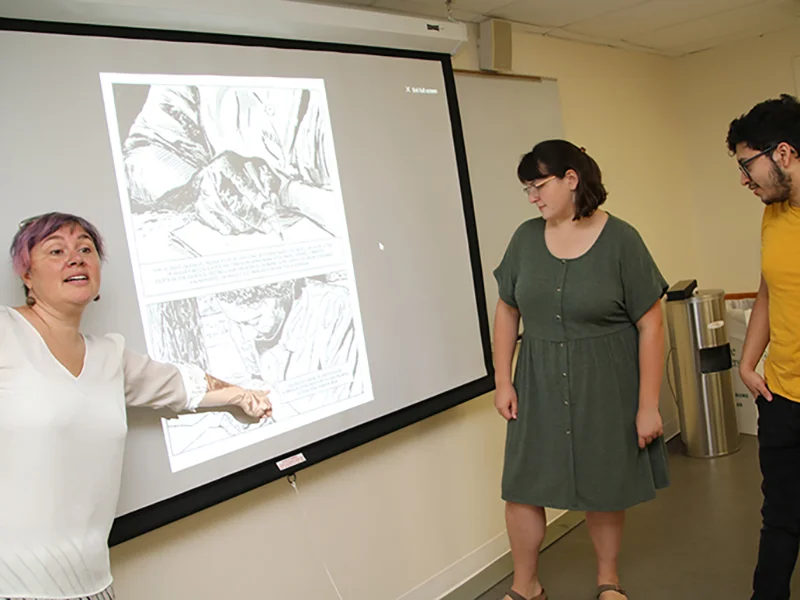 Professor Megwen Loveless with students in language class